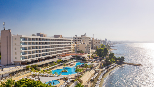 Aerial view of Royal Apollonia Hotel by the beach.